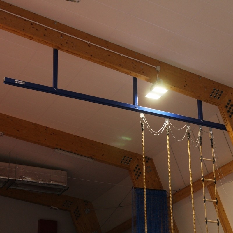 Running rail for hanging ropes, ladders and gymnastic wheels